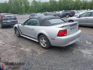2002 Ford Mustang Deluxe z VIN 1FAFP44492F221578, wystawiony jako IAAI lot #42242232 z przebiegiem 107 773 mil mil oraz . Historia ofert i sprzedaży dostępna na DreamBid. Obrazek 3.