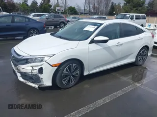 2017 Honda Civic EX-L z VIN 2HGFC1F79HH635156, wystawiony jako IAAI lot #41922115 z przebiegiem 142 565 mil mil oraz . Historia ofert i sprzedaży dostępna na DreamBid. Obrazek 2.