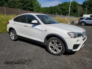2015 BMW X4 xDrive28i with VIN 5UXXW3C51F0M89005, listed as a Copart auction lot 57392984 with 142,385 mi miles. Bid and sale history available at carsss.com. Image 4.