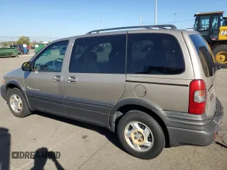 2000 Pontiac Montana z VIN 1GMDU23E1YD161191, wystawiony jako Copart lot #75875084 z przebiegiem 127 983 mil mil oraz Szkoda całkowita • Salvage title. Historia ofert i sprzedaży dostępna na DreamBid. Obrazek 2.