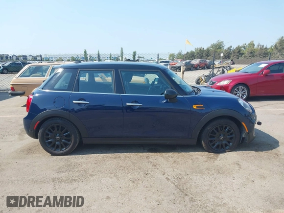 2015 MINI Hardtop 4 Door with VIN WMWXS5C50FT830060, listed as a IAAI auction lot 42744826 with 99,813 mi miles and . Bid and sale history available at DreamBid. Image 13.