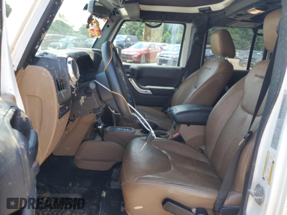 2015 Jeep Wrangler Unlimited Rubicon with VIN 1C4BJWFG6FL710993, listed as a Copart auction lot 62308195 with 103,938 mi miles and Salvage title. Bid and sale history available at DreamBid. Image 7.