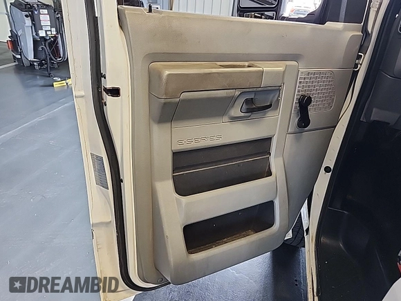 2010 Ford Econoline Cargo Commercial with VIN 1FTNE2EW4ADA72071, listed as a IAAI auction lot 42636413 with 186,263 mi miles and . Bid and sale history available at DreamBid. Image 14.