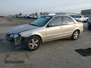 2002 Mazda Protege DX with VIN JM1BJ225621576389, listed as a Copart auction lot 42727745 with 185,042 mi miles and Salvage Title. Bid and sale history available at DreamBid. Image 1.
