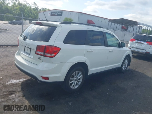 2015 Dodge Journey SXT with VIN 3C4PDCBG0FT653857, listed as a IAAI auction lot 42128410 with 182,960 mi miles and . Bid and sale history available at DreamBid. Image 4.