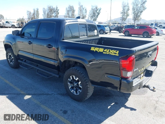 2018 Toyota Tacoma SR with VIN 3TMCZ5AN2JM127244, listed as a IAAI auction lot 41698199 with 61,535 mi miles and . Bid and sale history available at DreamBid. Image 3.