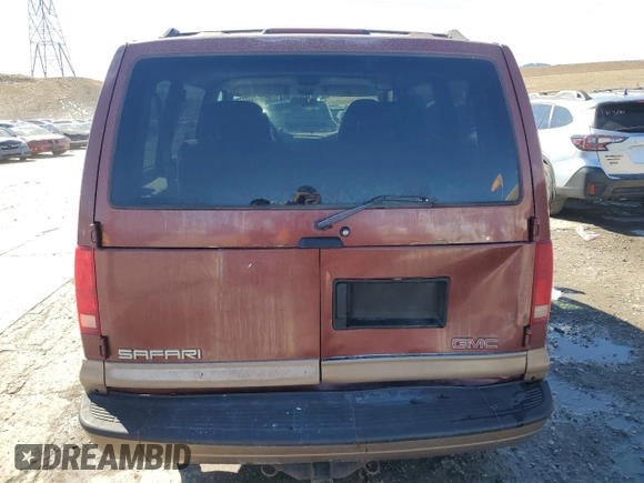 1999 GMC Safari z VIN 1GKEL19W2XB506085, wystawiony jako Copart lot #45527785 z przebiegiem 213 594 mil mil oraz Szkoda całkowita • Salvage title. Historia ofert i sprzedaży dostępna na DreamBid. Obrazek 6.
