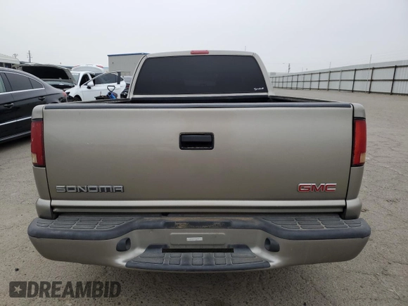 2001 GMC Sonoma SLS 1SG z VIN 1GTCS19W318154175, wystawiony jako Copart lot #79110724 z przebiegiem 135 746 mil mil oraz Szkody całkowita. Historia ofert i sprzedaży dostępna na DreamBid. Obrazek 6.
