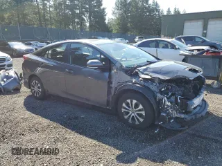 2021 Toyota Prius LE with VIN JTDKAMFP7M3185847, listed as a Copart auction lot 52897465 with 58,996 mi miles and Salvage Title. Bid and sale history available at DreamBid. Image 4.