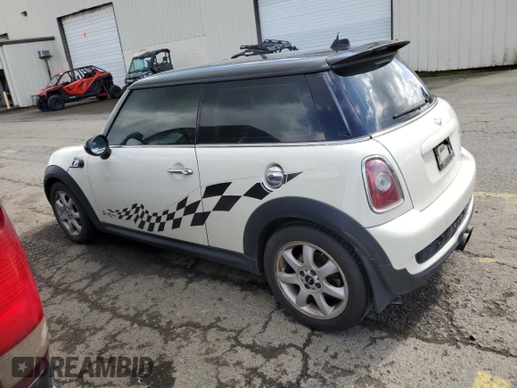 2009 MINI Hardtop S with VIN WMWMF73569TW84934, listed as a Copart auction lot 51344975 with 123,929 mi miles and Salvage title. Bid and sale history available at DreamBid. Image 2.