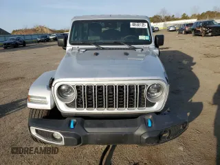 2024 Jeep Wrangler Sahara with VIN 1C4RJXP60RW128448, listed as a Copart auction lot 48658135 with 5,879 mi miles and Salvage Title. Bid and sale history available at DreamBid. Image 5.