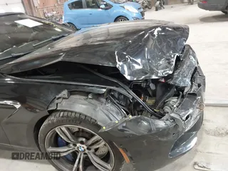 2014 BMW M6 z VIN WBSLZ9C58EDZ78401, wystawiony jako IAAI lot #41840114 z przebiegiem 23 499 mil mil oraz . Historia ofert i sprzedaży dostępna na DreamBid. Obrazek 17.