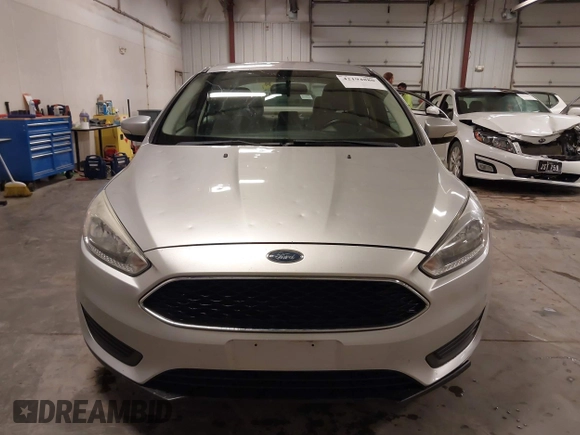 2017 Ford Focus SE z VIN 1FADP3F20HL245291, wystawiony jako IAAI lot #42194880 z przebiegiem 93 764 mil mil oraz . Historia ofert i sprzedaży dostępna na DreamBid. Obrazek 12.