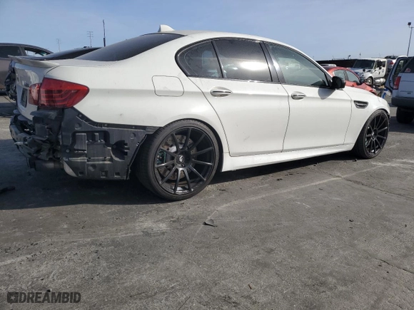 2014 BMW M5 with VIN WBSFV9C56ED097642, listed as a Copart auction lot 77905514 with 77,022 mi miles and Salvage Title. Bid and sale history available at carsss.com. Image 3.