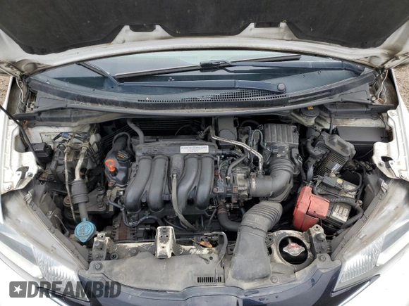 2015 Honda Fit EX-L z VIN 3HGGK5H84FM107978, wystawiony jako Copart lot #54879335 z przebiegiem 193 583 mil mil oraz Nie do naprawy • Non repairable. Historia ofert i sprzedaży dostępna na DreamBid. Obrazek 11.
