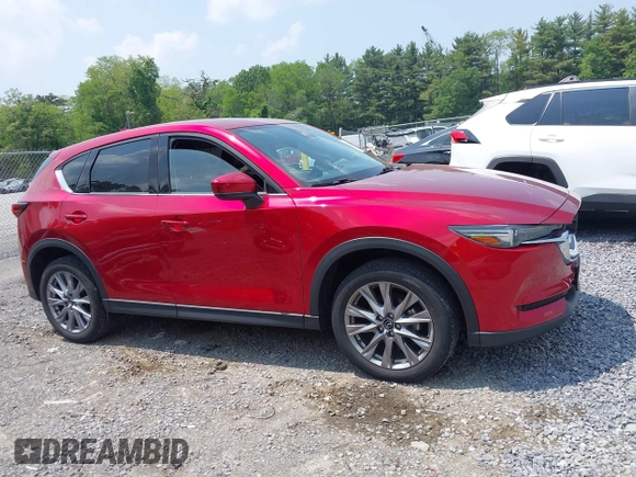 2021 Mazda CX-5 Grand Touring with VIN JM3KFBDM3M0434569, listed as a IAAI auction lot 42422349 with 25,924 mi miles and . Bid and sale history available at DreamBid. Image 13.