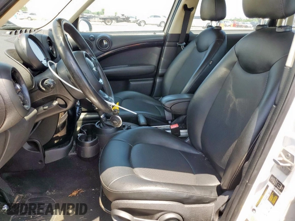 2015 MINI Countryman with VIN WMWZB3C52FWR43973, listed as a Copart auction lot 56751695 with 117,096 mi miles and Salvage title. Bid and sale history available at DreamBid. Image 7.