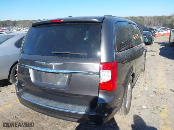 2016 Chrysler Town & Country Touring with VIN 2C4RC1BG4GR297286, listed as a IAAI auction lot 41333098 with 216,500 mi miles. Bid and sale history available at carsss.com. Image 4.