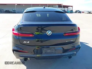 2021 BMW X4 xDrive30i z VIN 5UX2V1C06M9E42747, wystawiony jako IAAI lot #41661458 z przebiegiem 66 292 mil mil oraz . Historia ofert i sprzedaży dostępna na DreamBid. Obrazek 17.