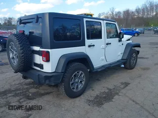 2015 Jeep Wrangler Unlimited Rubicon with VIN 1C4BJWFGXFL507315, listed as a IAAI auction lot 42059720 with 90,189 mi miles and . Bid and sale history available at DreamBid. Image 4.