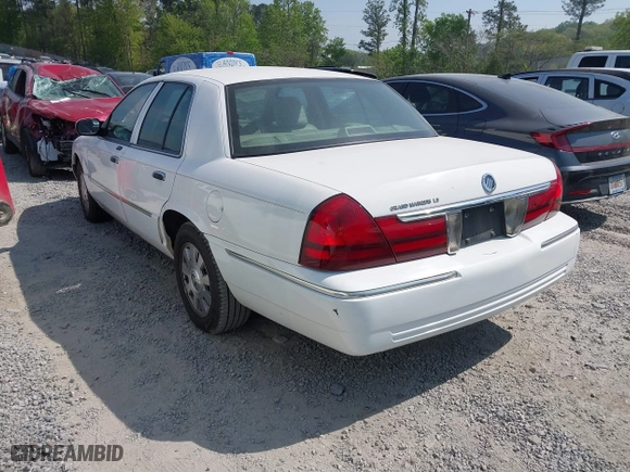 2003 Mercury Grand Marquis LS Premium with VIN 2MEFM75W33X669341, listed as a IAAI auction lot 42063018 with 124,047 mi miles. Bid and sale history available at carsss.com. Image 3.