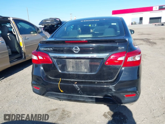 2019 Nissan Sentra S z VIN 3N1AB7AP1KY456992, wystawiony jako IAAI lot #41237654 z przebiegiem 88 099 mil mil oraz . Historia ofert i sprzedaży dostępna na DreamBid. Obrazek 16.