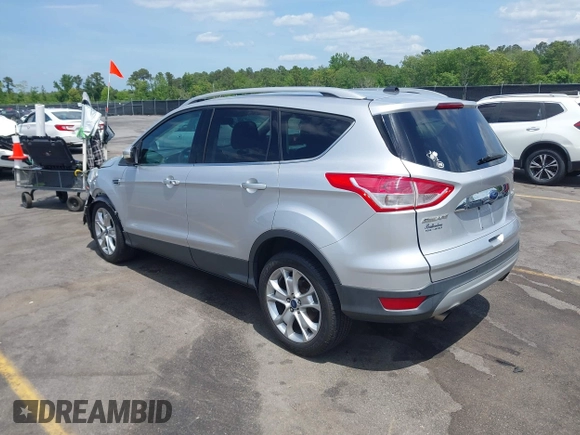 2014 Ford Escape Titanium with VIN 1FMCU0JX7EUA28824, listed as a IAAI auction lot 42065325 with 107,761 mi miles. Bid and sale history available at carsss.com. Image 3.
