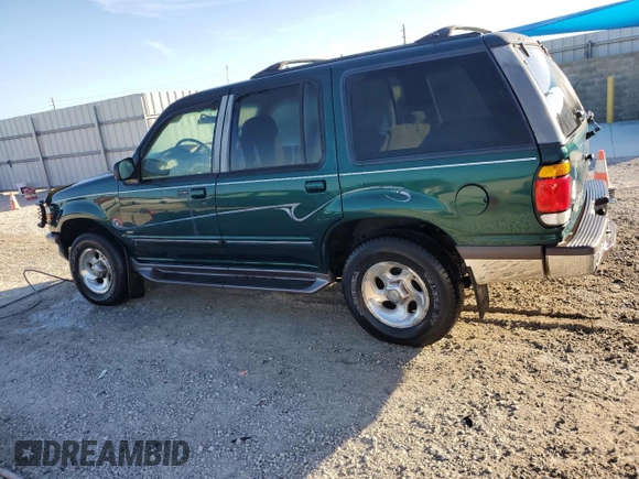 1997 Ford Explorer XL with VIN 1FMDU34E5VZB40878, listed as a Copart auction lot 84009744 with 185,047 mi miles and Salvage title. Bid and sale history available at DreamBid. Image 2.