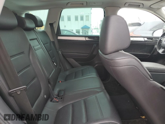 2012 Volkswagen Touareg Sport z VIN WVGEF9BP8CD006057, wystawiony jako Copart lot #47739265 z przebiegiem 213 580 mil mil oraz Szkoda całkowita • Salvage title. Historia ofert i sprzedaży dostępna na DreamBid. Obrazek 10.