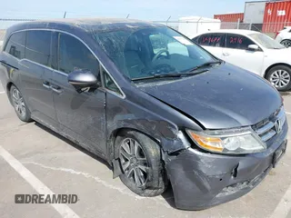 2014 Honda Odyssey Touring with VIN 5FNRL5H91EB093540, listed as a IAAI auction lot 41887412 with 202,076 mi miles and . Bid and sale history available at DreamBid. Image 6.