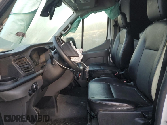 2020 Ford Transit Cargo with VIN 1FTBF4XG3LKB70573, listed as a Copart auction lot 77039474 with 131,873 mi miles and Salvage Title. Bid and sale history available at DreamBid. Image 7.