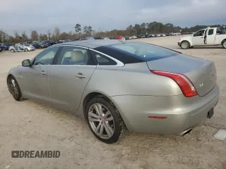 2014 Jaguar XJ with VIN SAJWA2GZ8E8V60138, listed as a Copart auction lot 86384064 with 137,190 mi miles and Salvage Title. Bid and sale history available at carsss.com. Image 2.