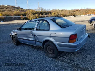 1997 Toyota Tercel CE z VIN JT2AC52L1V0227973, wystawiony jako Copart lot #77300554 z przebiegiem 301 799 mil mil oraz Szkoda całkowita • Salvage title. Historia ofert i sprzedaży dostępna na DreamBid. Obrazek 2.
