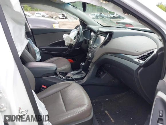 2014 Hyundai Santa Fe z VIN 5XYZUDLB9EG227009, wystawiony jako IAAI lot #42272191 z przebiegiem 97 474 mil mil oraz . Historia ofert i sprzedaży dostępna na DreamBid. Obrazek 5.