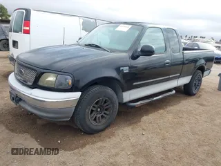 2002 Ford F-150 XL with VIN 1FTRX17W92NC06992, listed as a IAAI auction lot 41194470 with 253,923 mi miles. Bid and sale history available at carsss.com. Image 2.