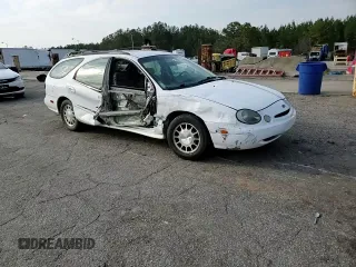 1999 Ford Taurus SE z VIN 1FAFP58S0XA272714, wystawiony jako Copart lot #48966215 z przebiegiem 255 885 mil mil oraz Szkoda całkowita • Salvage title. Historia ofert i sprzedaży dostępna na DreamBid. Obrazek 11.