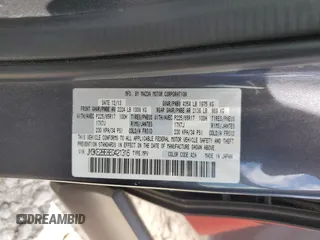 2014 Mazda CX-5 Sport z VIN JM3KE2BE8E0421316, wystawiony jako Copart lot #56548005 z przebiegiem 203 096 mil mil oraz Szkoda całkowita • Salvage title. Historia ofert i sprzedaży dostępna na DreamBid. Obrazek 13.