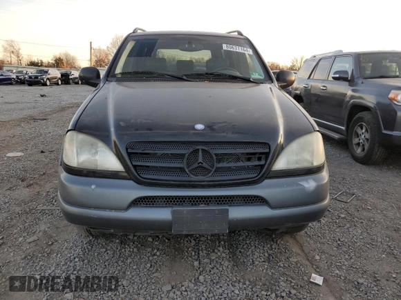 1999 Mercedes-Benz M-Class with VIN 4JGAB54E3XA092934, listed as a Copart auction lot 80631164 with 180,734 mi miles and Salvage Title. Bid and sale history available at carsss.com. Image 5.