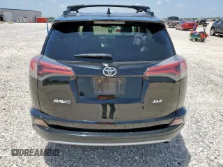 2018 Toyota RAV4 XLE with VIN 2T3WFREV7JW429716, listed as a Copart auction lot 64309045 with 156,445 mi miles and Salvage title. Bid and sale history available at DreamBid. Image 6.