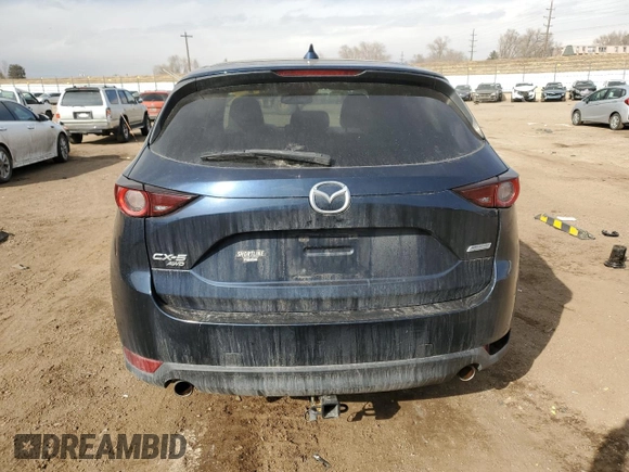 2017 Mazda CX-5 Touring z VIN JM3KFBCL7H0212955, wystawiony jako Copart lot #46096525 z przebiegiem 94 606 mil mil oraz Szkody całkowita. Historia ofert i sprzedaży dostępna na DreamBid. Obrazek 6.