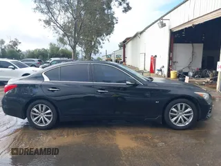 2014 Infiniti Q50 with VIN JN1BV7AP8EM675841, listed as a IAAI auction lot 41582924 with 139,637 mi miles. Bid and sale history available at carsss.com. Image 14.