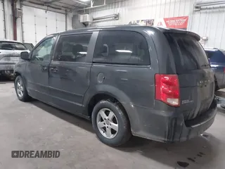 2012 Dodge Grand Caravan SXT with VIN 2C4RDGCG7CR358266, listed as a IAAI auction lot 41582428 with 169,137 mi miles and . Bid and sale history available at DreamBid. Image 3.