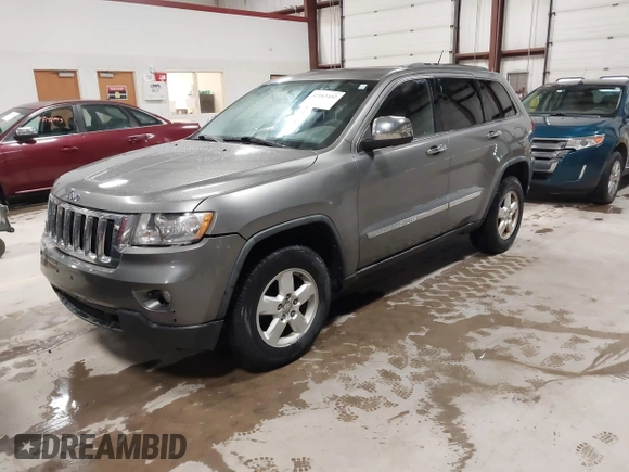 2011 Jeep Grand Cherokee Laredo with VIN 1J4RR4GG3BC623048, listed as a IAAI auction lot 42163452 with 192,241 mi miles and . Bid and sale history available at DreamBid. Image 2.