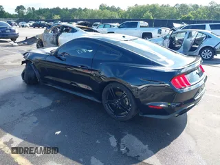 2019 Ford Mustang EcoBoost with VIN 1FA6P8THXK5124729, listed as a IAAI auction lot 42384176 with 134,028 mi miles and . Bid and sale history available at DreamBid. Image 3.