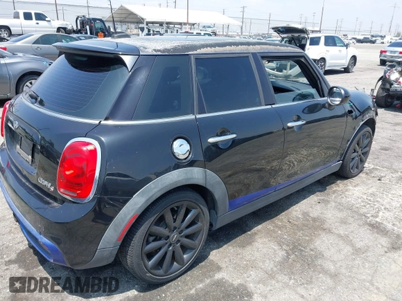 2015 MINI Hardtop 4 Door S with VIN WMWXU3C58F2B66601, listed as a IAAI auction lot 42444404 with 76,174 mi miles and . Bid and sale history available at DreamBid. Image 4.