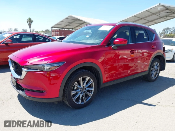 2021 Mazda CX-5 Grand Touring with VIN JM3KFADM5M0470483, listed as a IAAI auction lot 42785031 with 30,749 mi miles and . Bid and sale history available at DreamBid. Image 17.