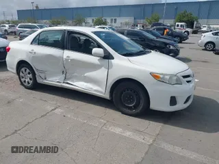 2012 Toyota Corolla L with VIN 5YFBU4EE1CP024715, listed as a IAAI auction lot 41906870 with 121,496 mi miles. Bid and sale history available at carsss.com. Image 1.