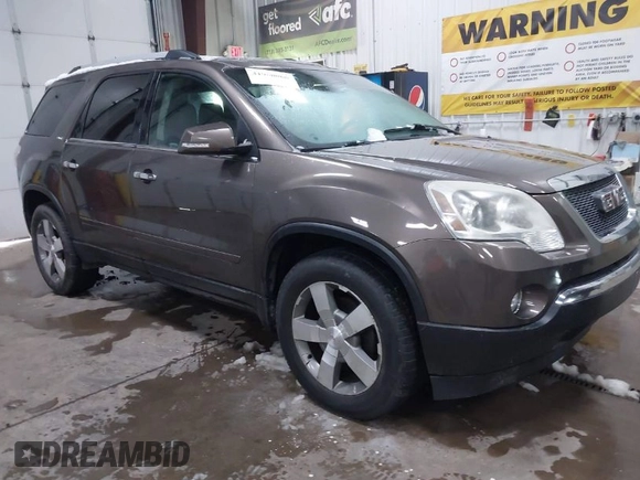 2011 GMC Acadia SLT1 with VIN 1GKKRREDXBJ331099, listed as a IAAI auction lot 41950066 with 128,067 mi miles. Bid and sale history available at carsss.com. Image 1.