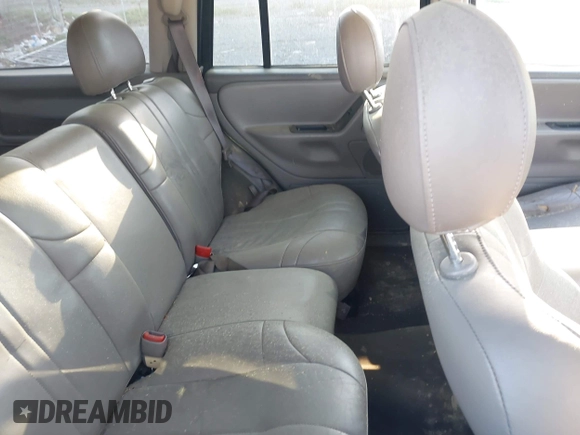 2002 Jeep Grand Cherokee with VIN 1J4GW38N42C202219, listed as a IAAI auction lot 42035162 with 220,012 mi miles and . Bid and sale history available at DreamBid. Image 8.