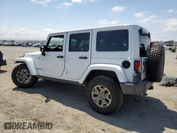 2015 Jeep Wrangler Unlimited Rubicon with VIN 1C4BJWFG6FL508493, listed as a Copart auction lot 54788635 with 127,694 mi miles and Salvage title. Bid and sale history available at DreamBid. Image 2.